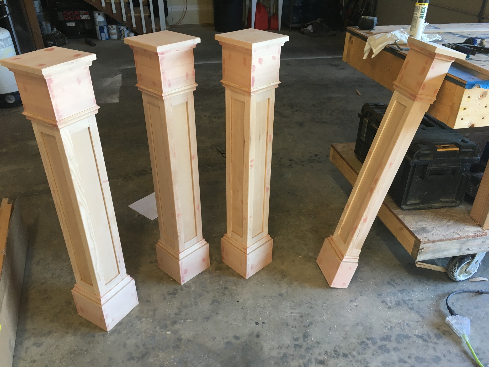 Handmade stair railing posts before painting and installation