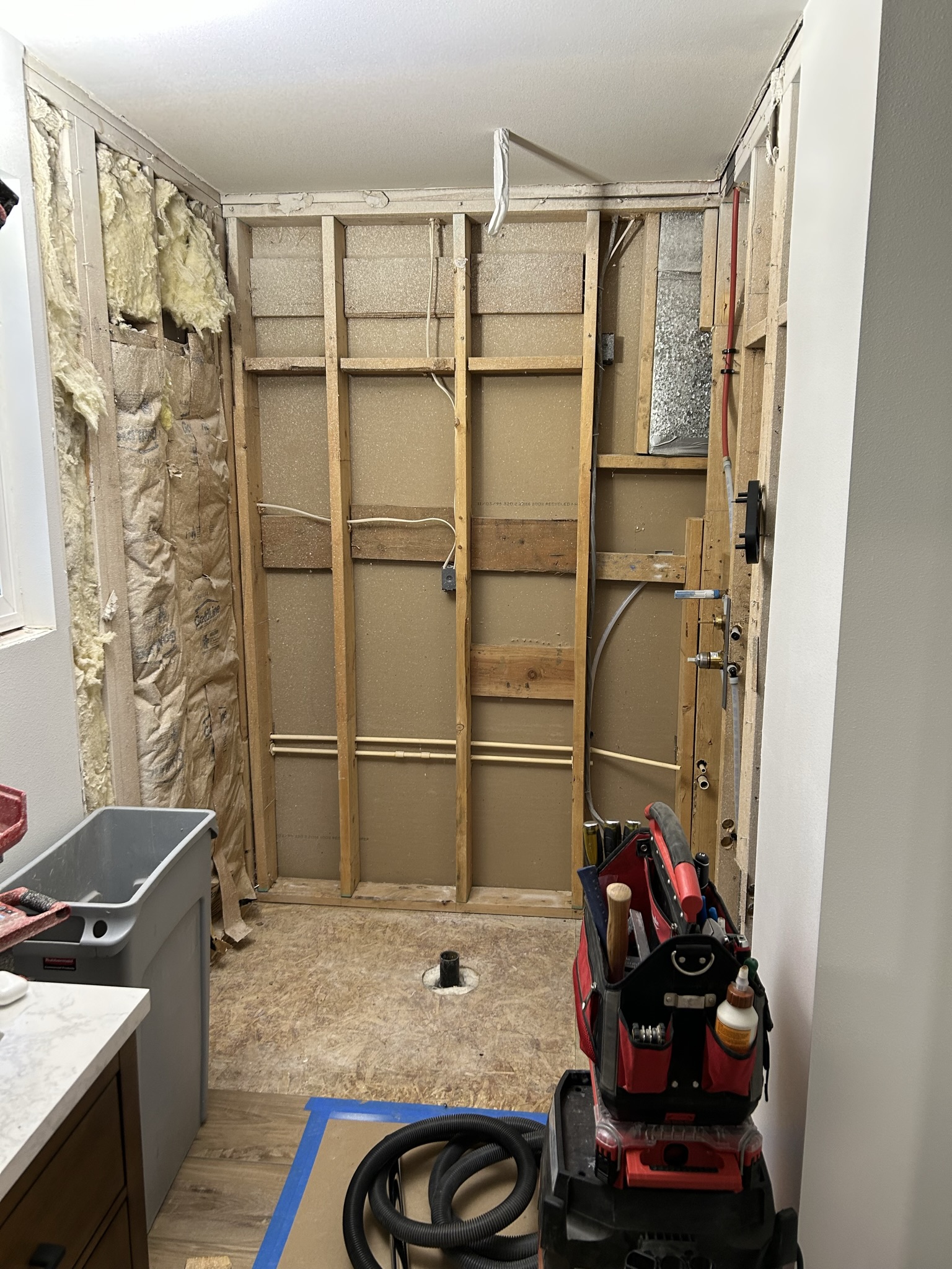 Shower area opened to the wall framing at the start of construction