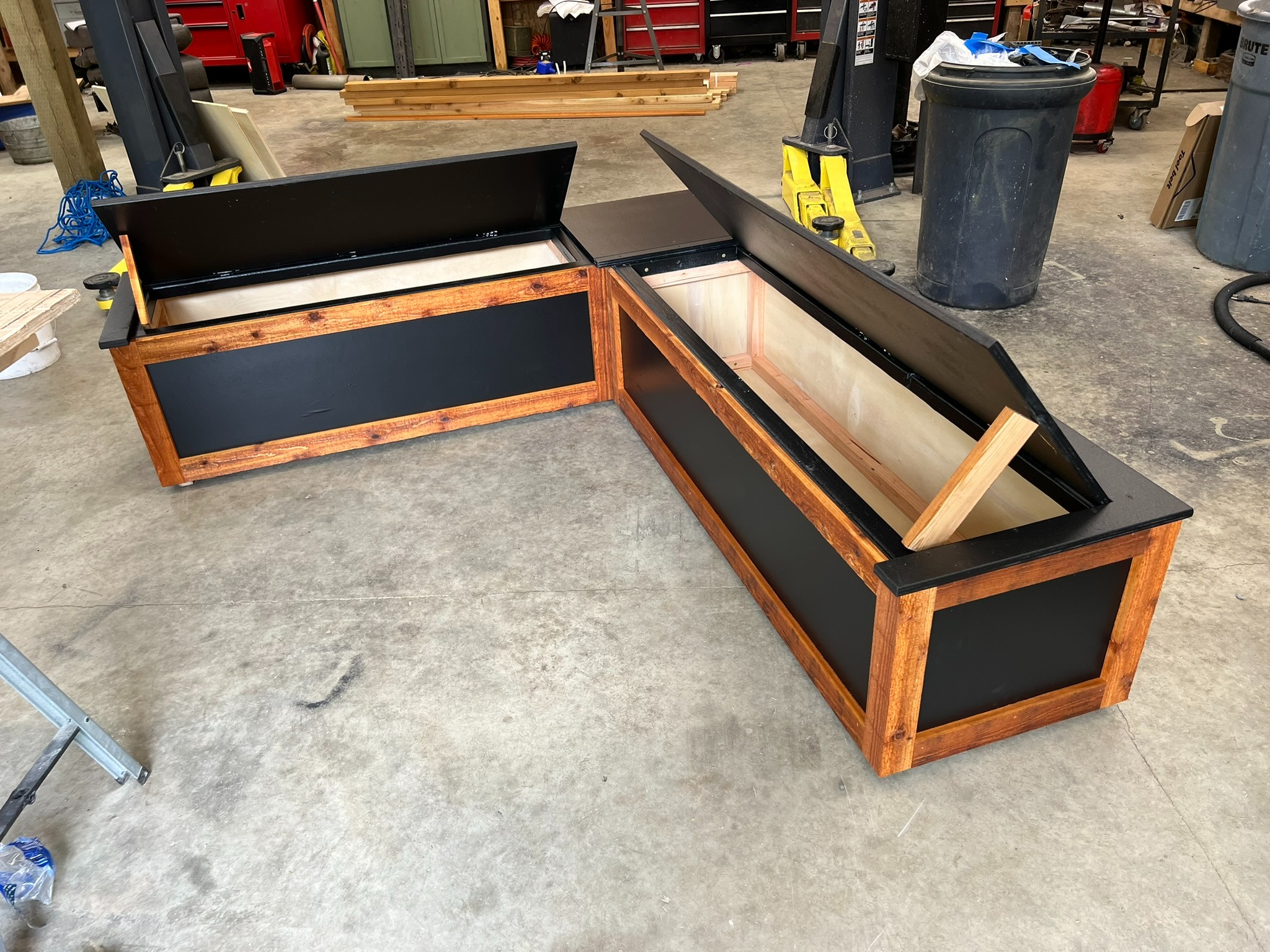 Custom L-shaped bench with both storage lids opened