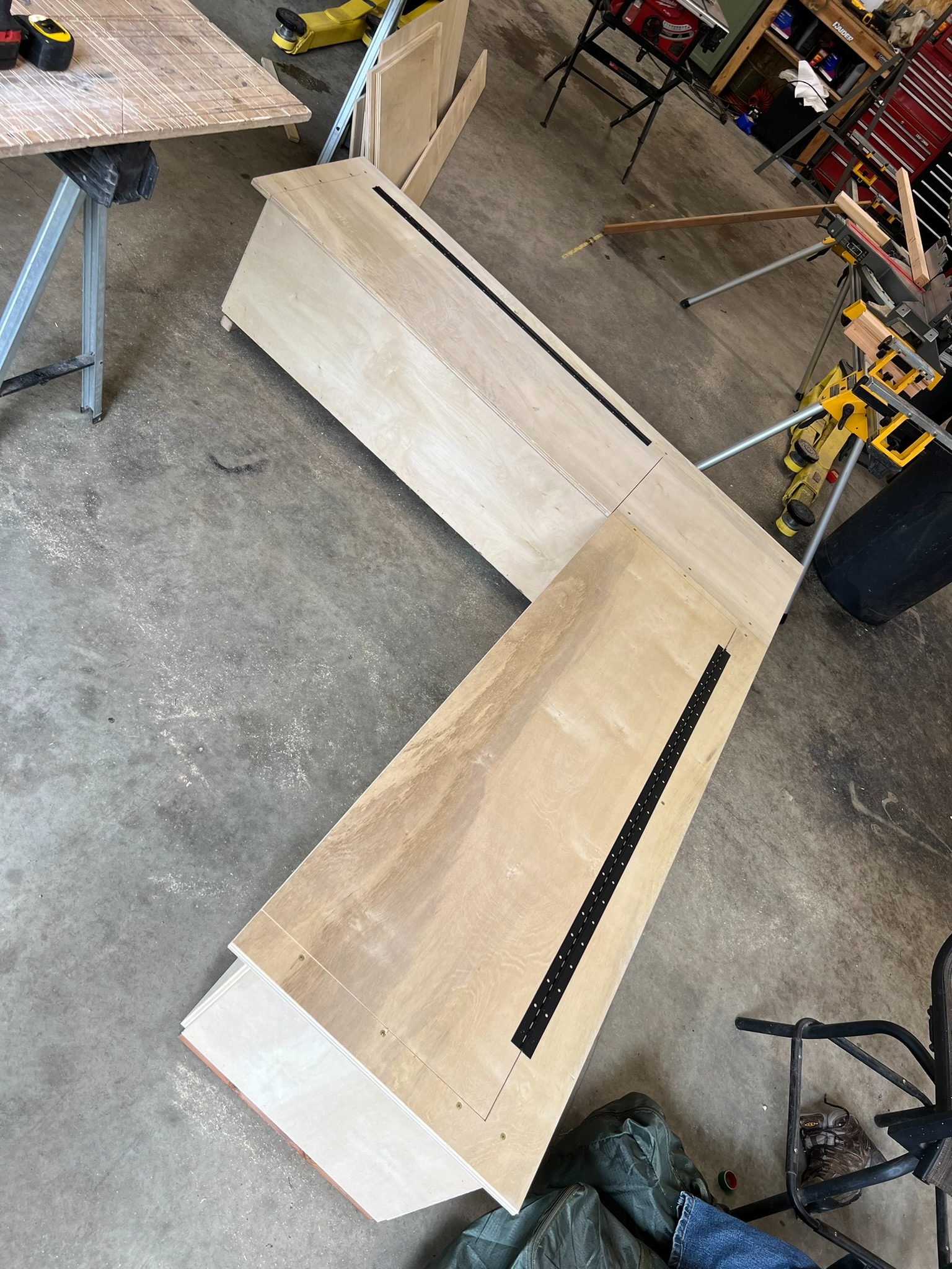 Wood bench panels and trim being fitted during construction